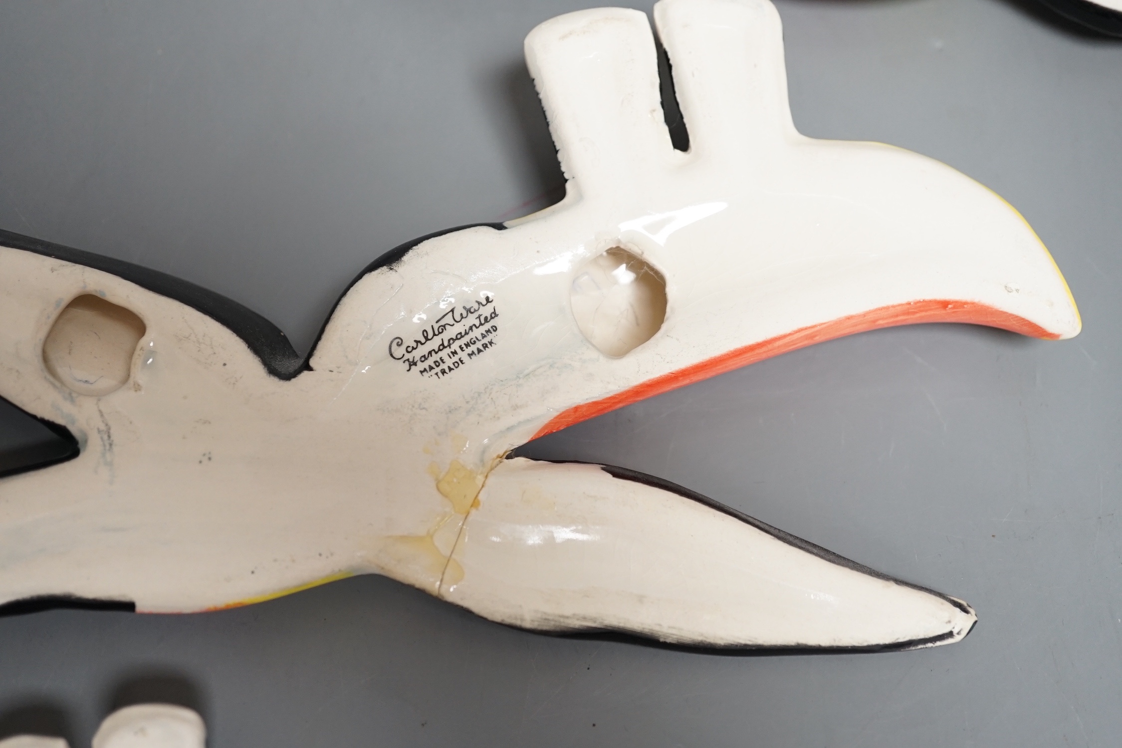 A graduated set of three Carlton ware toucan wall plaques